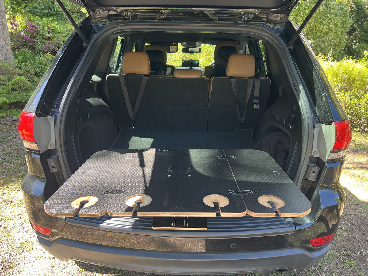 Folded wooden Bootlid table in the boot